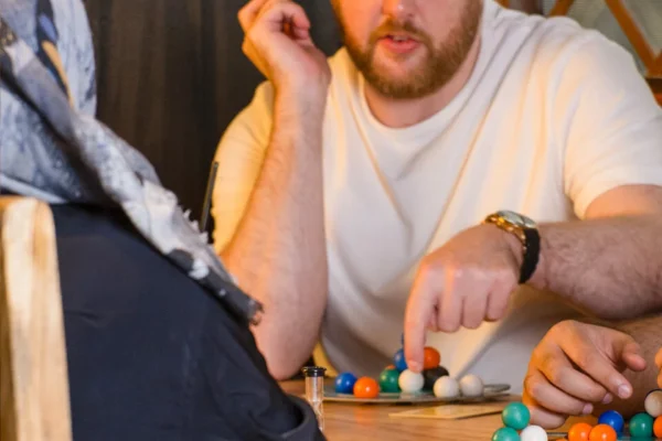 Man-Playing-Board-Games Man-Playing-Board-Games